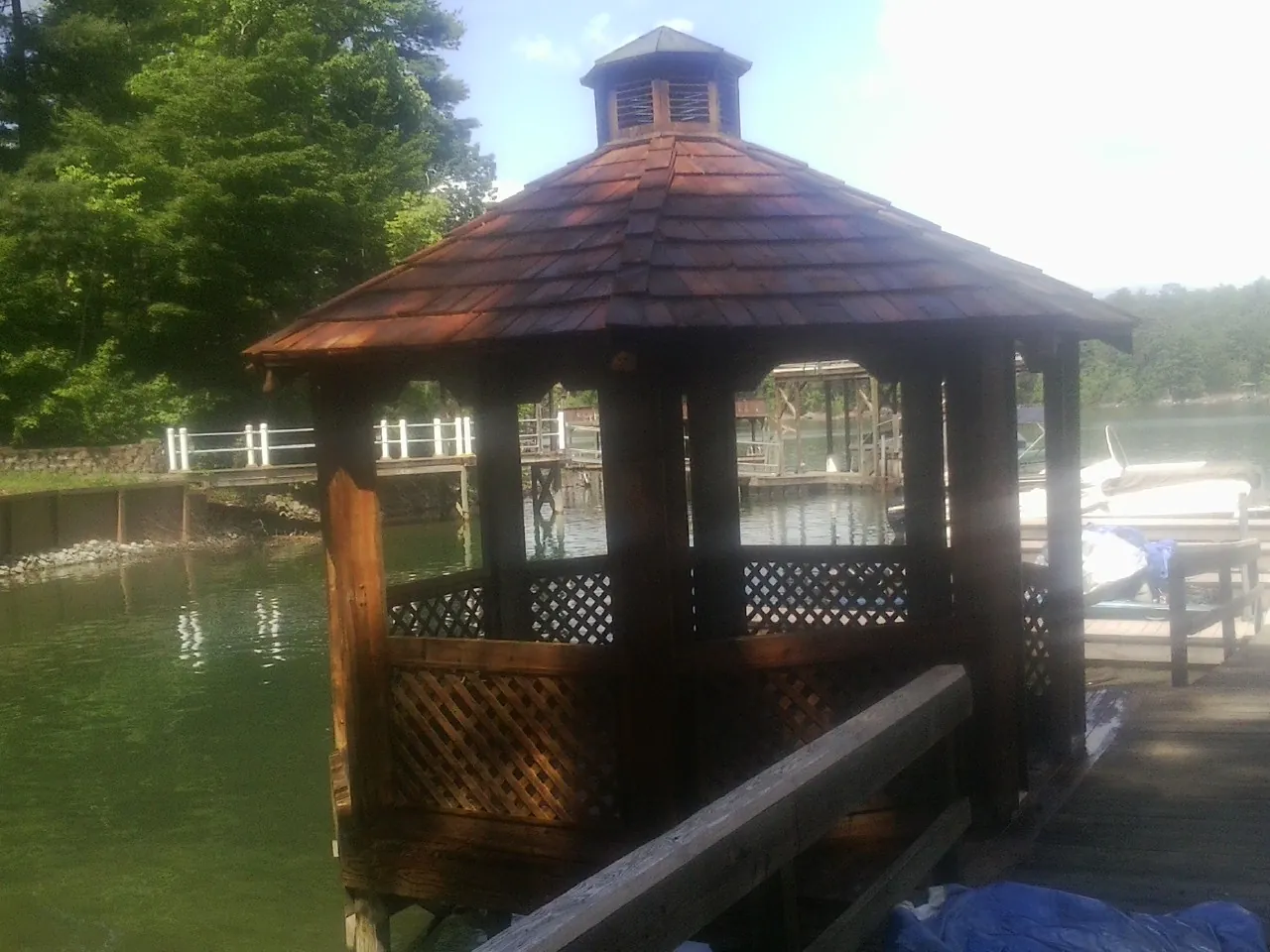 Cedar shake gazebo roof rebuilt on a lake dock in Ville Platte